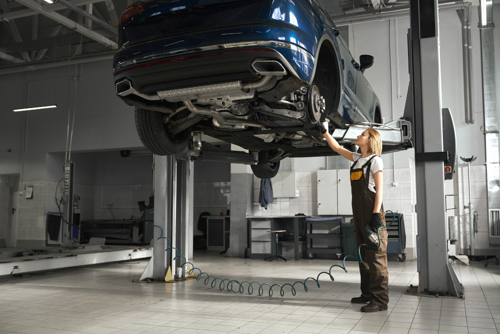 Modern automotive lift in Dubai workshop servicing luxury vehicles with advanced hydraulic lifting system.